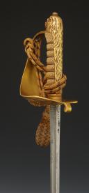 Photo 11 : SABRE D'OFFICIER DE LA MARINE INDIENNE AYANT APPARTENU AU COMMANDER HEDLEY VICARS BANFIELD, Commandant du vaisseau HMIS LAWRENCE en 1940, Première moitié du XXème siècle. 32670