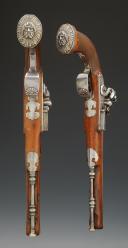 Photo 1 : LONG PAIR OF GENERAL OFFICER'S POWERFUL PISTOLS TO THE REGULATION OF VENDÉMIAIRE AN XII, signed "Boutet Artist Director - Manufacture in Versailles", Consulate - First Empire. 27973