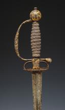 Photo 3 : COURT SWORD IN POLISHED STEEL WITH HUNTING DECOR AND GOLD BACKGROUND, Former Monarchy, reign of Louis XV, circa 1745-1755. Item No. 28808.
