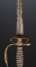 Photo 7 : COURT SWORD IN POLISHED STEEL WITH HUNTING DECOR AND GOLD BACKGROUND, Former Monarchy, reign of Louis XV, circa 1745-1755. Item No. 28808.