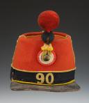 SHAKO OF THE 90th INFANTRY REGIMENT, 1st BATTALION, model 1868, Second Empire. Inventory number 31235R.