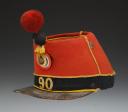 Photo 3 : SHAKO OF THE 90th INFANTRY REGIMENT, 1st BATTALION, model 1868, Second Empire. Inventory number 31235R.