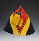 BONNET DE POLICE TROUPE DU 1er RÉGIMENT DE VOLTIGEURS DE LA GARDE IMPÉRIALE, modèle 1860 « à soufflet », Second Empire. 27735
