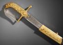 Photo 10 : Gold sabre by the Austrian cutler Kolbe with the cipher of Emperor Napoleon, First Empire, circa 1810. PHILIPPE MISSILLIER COLLECTION, Giquello auction house, Drouot - rooms 5-6, March 6 & 7, 2025.