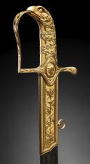 Photo 4 : Gold sabre by the Austrian cutler Kolbe with the cipher of Emperor Napoleon, First Empire, circa 1810. PHILIPPE MISSILLIER COLLECTION, Giquello auction house, Drouot - rooms 5-6, March 6 & 7, 2025.