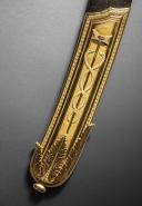 Photo 6 : Gold sabre by the Austrian cutler Kolbe with the cipher of Emperor Napoleon, First Empire, circa 1810. PHILIPPE MISSILLIER COLLECTION, Giquello auction house, Drouot - rooms 5-6, March 6 & 7, 2025.