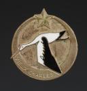 OLD BADGE POSSIBLY ATTRIBUTED TO THE YOUTH WORKSHOPS, World War II. 31982-4