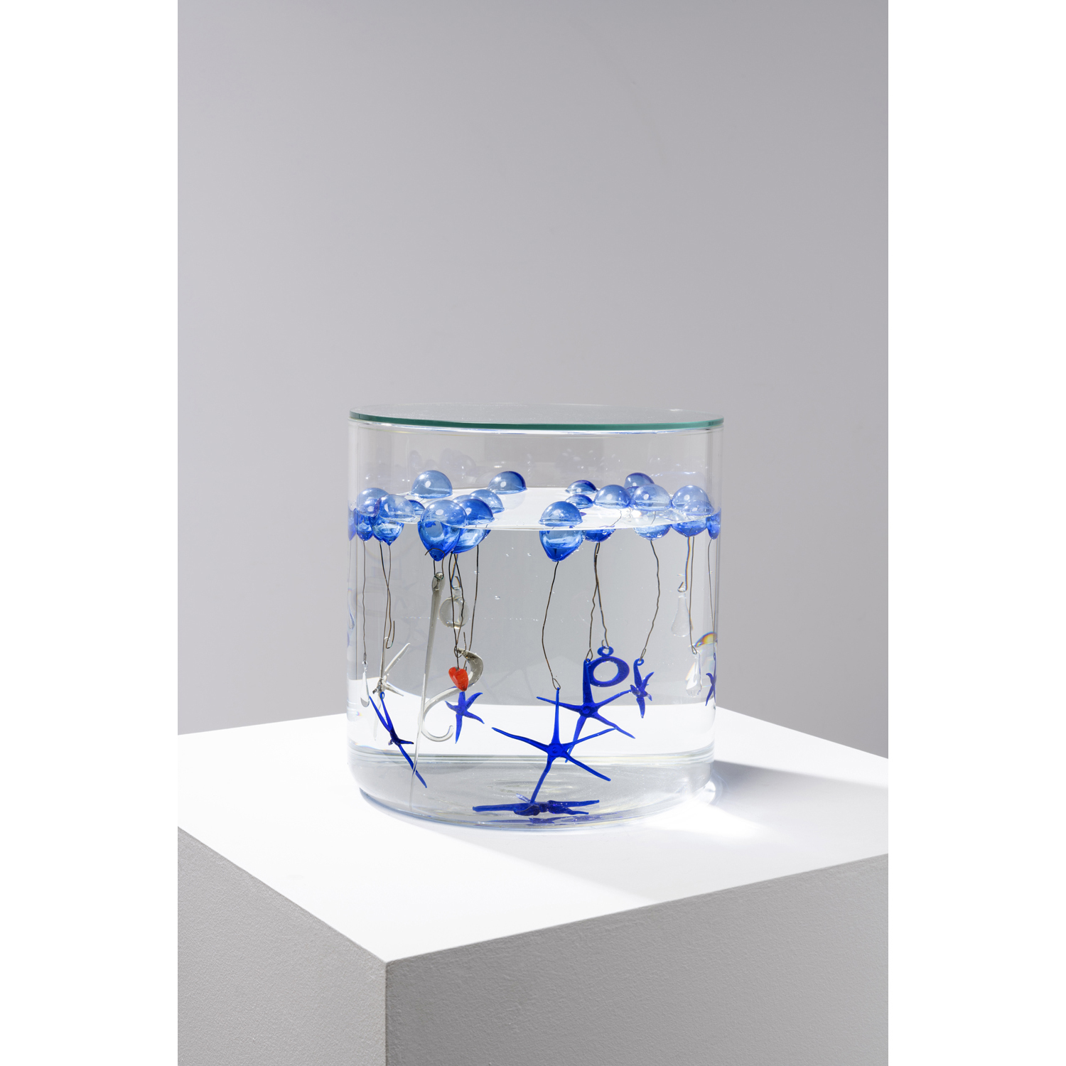 Jean-Michel Othoniel (born 1964) Bottle of Tears, Lágrimas series, 2008 Glass, demineralized water, metal Height: 30 cm Diameter: 30 cm Provenance: - Purchased from the artist by the current owner - A.M. collection, Paris Exhibitions: Saint Etienne, Musée d'art moderne, 'Lágrimas', 2003, similar work Paris, Centre Pompidou, 'My way', 2 March to 23 May 2011, similar work Note: 'Lágrimas est faite de pampilles de larmes, éléments de verre suspendus dans des vases remplis d'eau. Elle s'inspire d'une tradition populaire du Nord de la France qui consiste à faire flotter dans des bouteilles les représentations du Christ.' (‘Lágrimas is made of tassels of tears, glass elements floating in vases filled with water. It is inspired by a popular tradition in Northern France which consists in making representations of Christ float inside bottles.’) Othoniel in Othoniel, 'Crystal Palace', Fondation Cartier, 2003