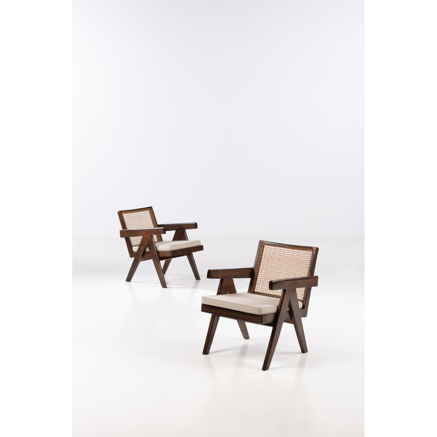 Pierre Jeanneret (1896-1967)  Easy armchairs  Paire de fauteuils  Teck et cannage  Date de création: vers 1955-1956