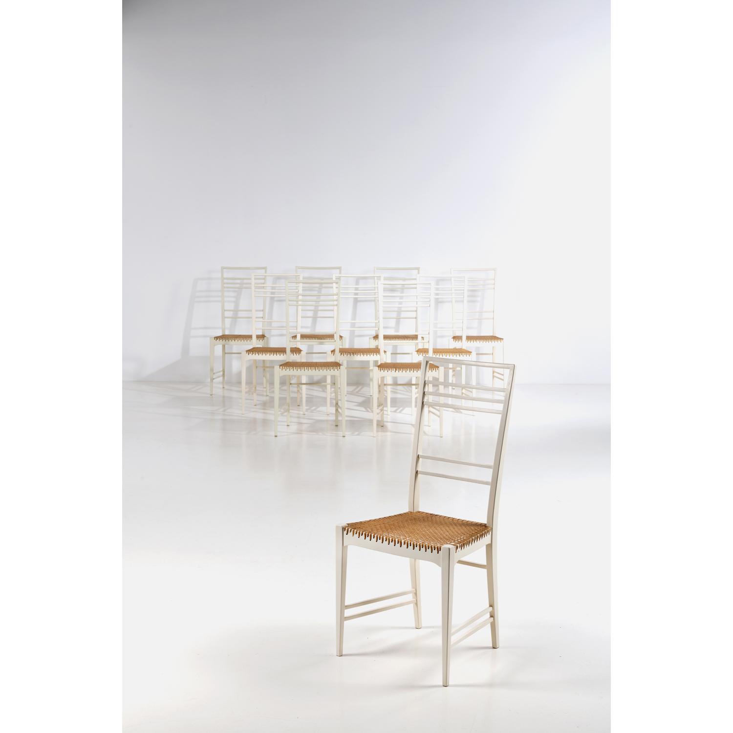 Erik Chambert (1902-1988) Poem Set of ten chairs Painted wood and caning Edited by Chamberts Model created in 1953 H 96 × L 44 × P 44 cm