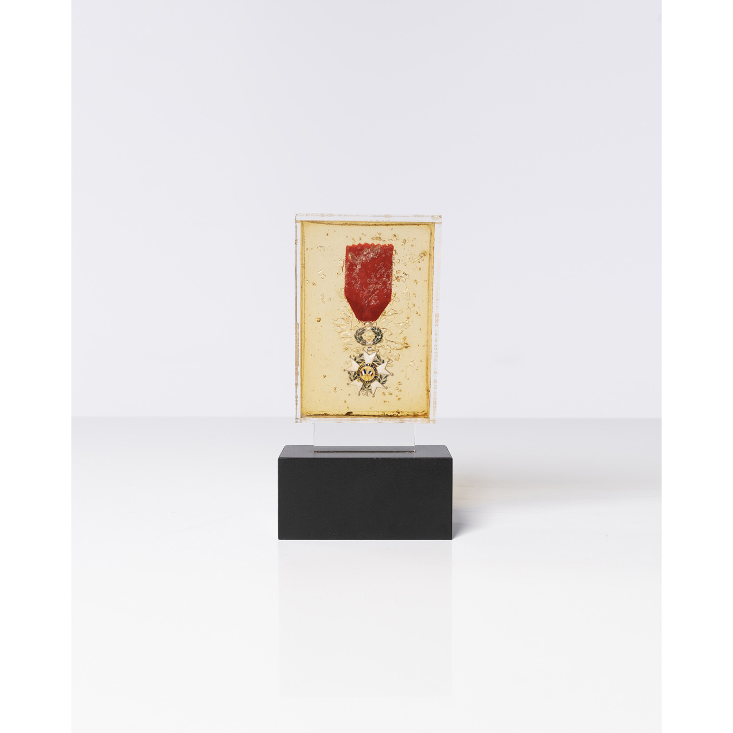 Arman (Armand Fernandez) (1928-2005) Légion d'honneur, 1970 Arman (Armand Fernandez) (1928-2005) Légion d'honneur, 1970 Metal inclusion in epoxy resin Signed on the bottom left 16,3 x 11,2 x 3,7 cm Provenance: Jean Ferrero collection, Nice Exhibition: - Cannes, Centre d'art La Malmaison, Villa Domergue, Arman, "Jean Ferrero collection, Les inédits", Jul. 7, 2006- Jan. 28, 2007 illustrated in color in the catalogue p. 74 - Nice, Musée Masséna, "Les années joyeuses", 28 March- 24 Aug. 2020, illustrated in color in the catalogue, p. 82 This work is recorded in Mrs. Denyse Durand-Ruel's Archives under n°4295. This work is recorded in the Arman Studio Archives New York under number: APA# 8003.70.396
