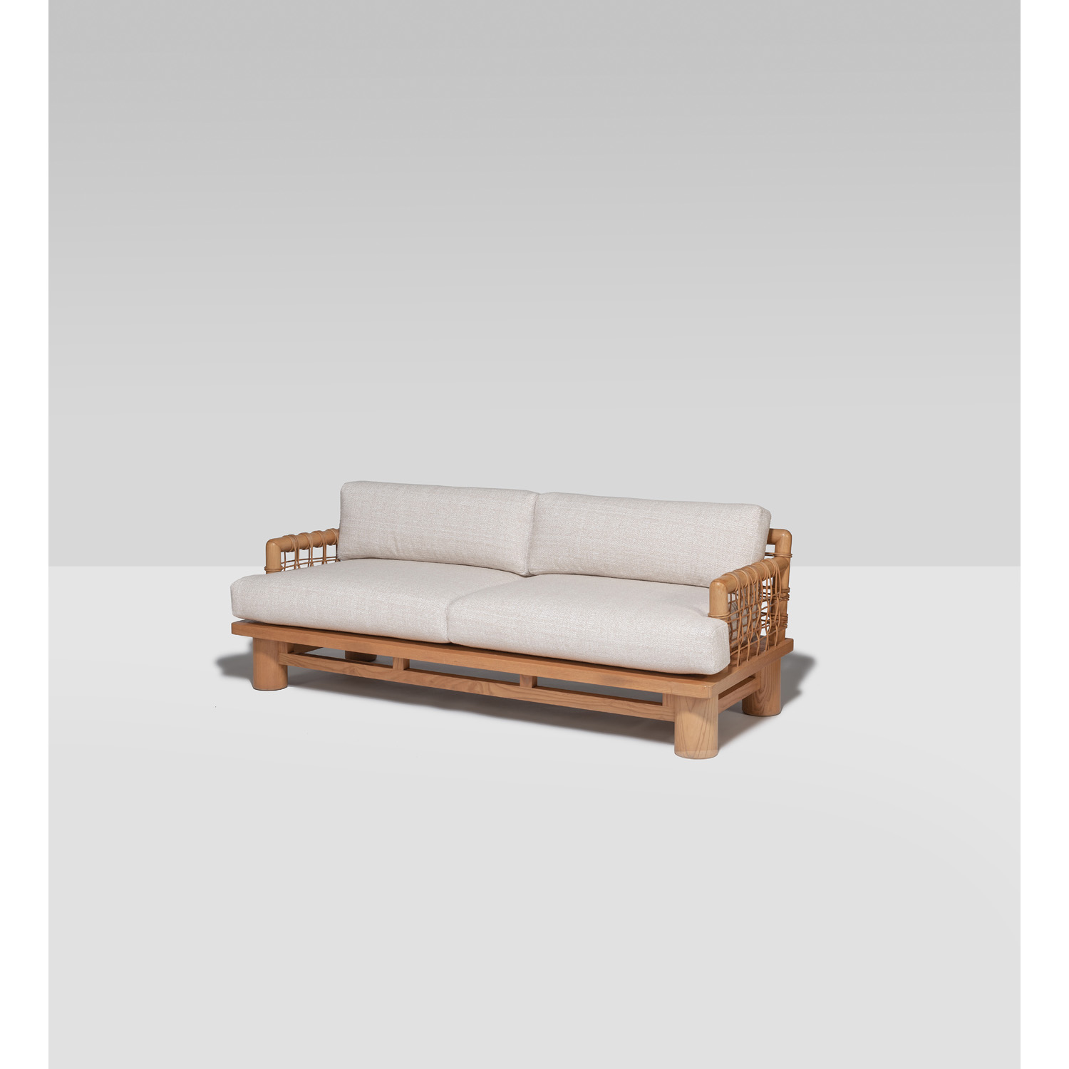 Karl Springer (1931-1991) Dowelwood Canap&eacute; Ch&ecirc;ne, rotin et textile Mod&egrave;le cr&eacute;&eacute; dans les ann&eacute;es 1970 H 84 &times; L 213,5 &times; P 91,5cm