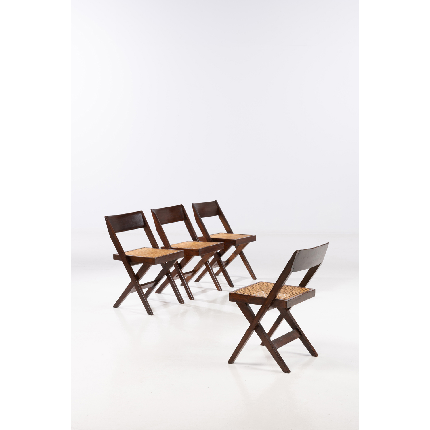 Pierre Jeanneret (1896-1967) et Eulie  Chowdhury (1923-1995)  Library chair  Série de quatre chaises  Teck et cannage