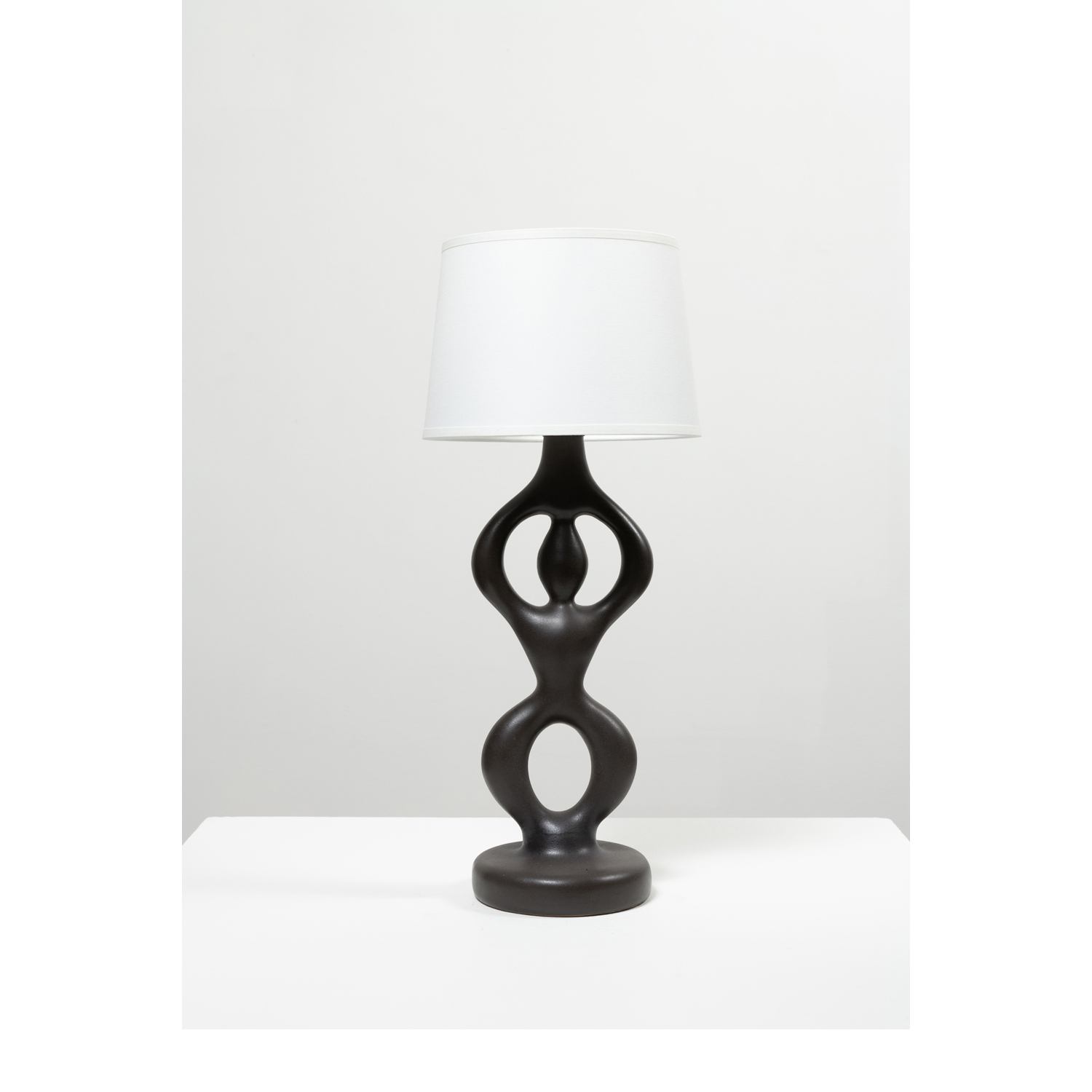 Pol Chambost (1906-1983) Anthropomorphic lamp, model n&deg;826 Glazed ceramic and fabric Embossed with 'POTERIE POL CHAMBOST FRANCE N&deg;826' Model created in 1953 Lamp body: H 34&times;&Oslash; 13cm Lampshade: H 14&times;&Oslash; 20cm Complete height: 39cm Bibliography: Pol Chambost, Sculpteur-c&eacute;ramiste, 1906-1983, Ph. Chambost, Somogy Ed. d'Art, 2006, similar model p. 53