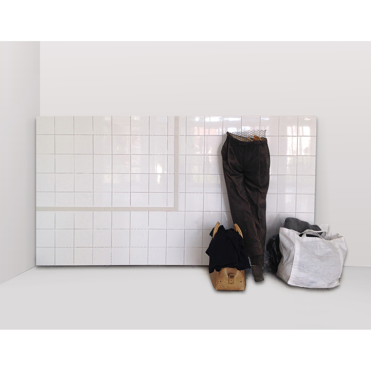 Lot 66 - Vlassis Caniaris (1928-2011) Image, 1972  Installation comprenant un mur de carreau de faïences, un mannequin, des vêtements, une valise en cuir et des sacs divers 