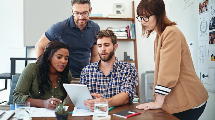 A dynamic digital transition consulting team reviews a client’s data to create a robust roadmap