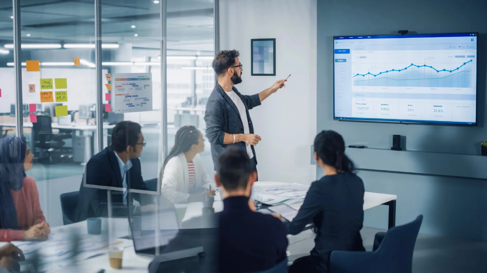 Team of people working on Microsoft platform in a modern office
