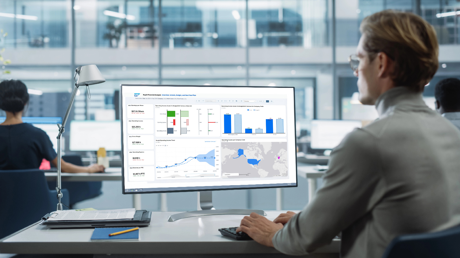 Professional man analyzing data in SAP software.