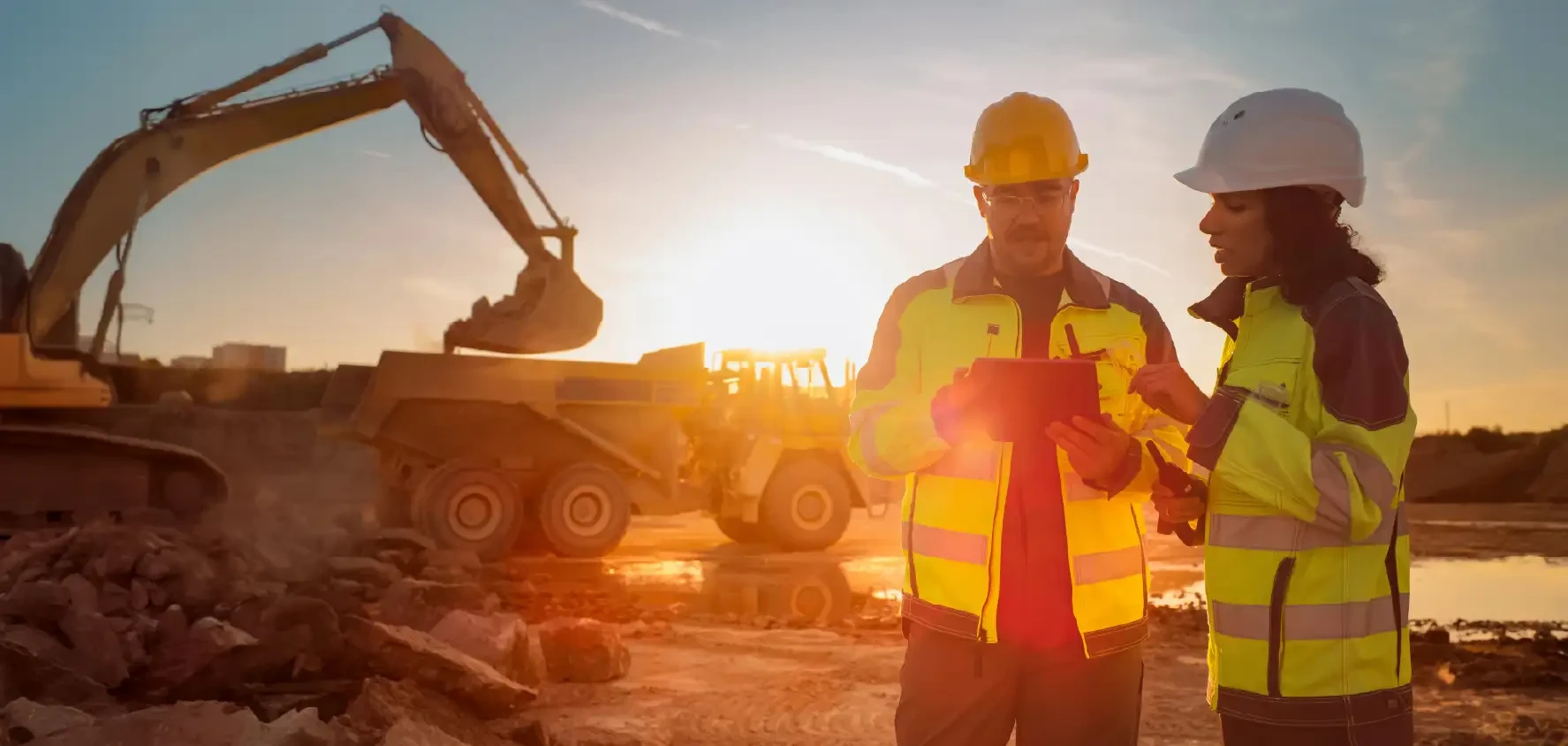 A mining operation showing the mining process with two workers monitoring.