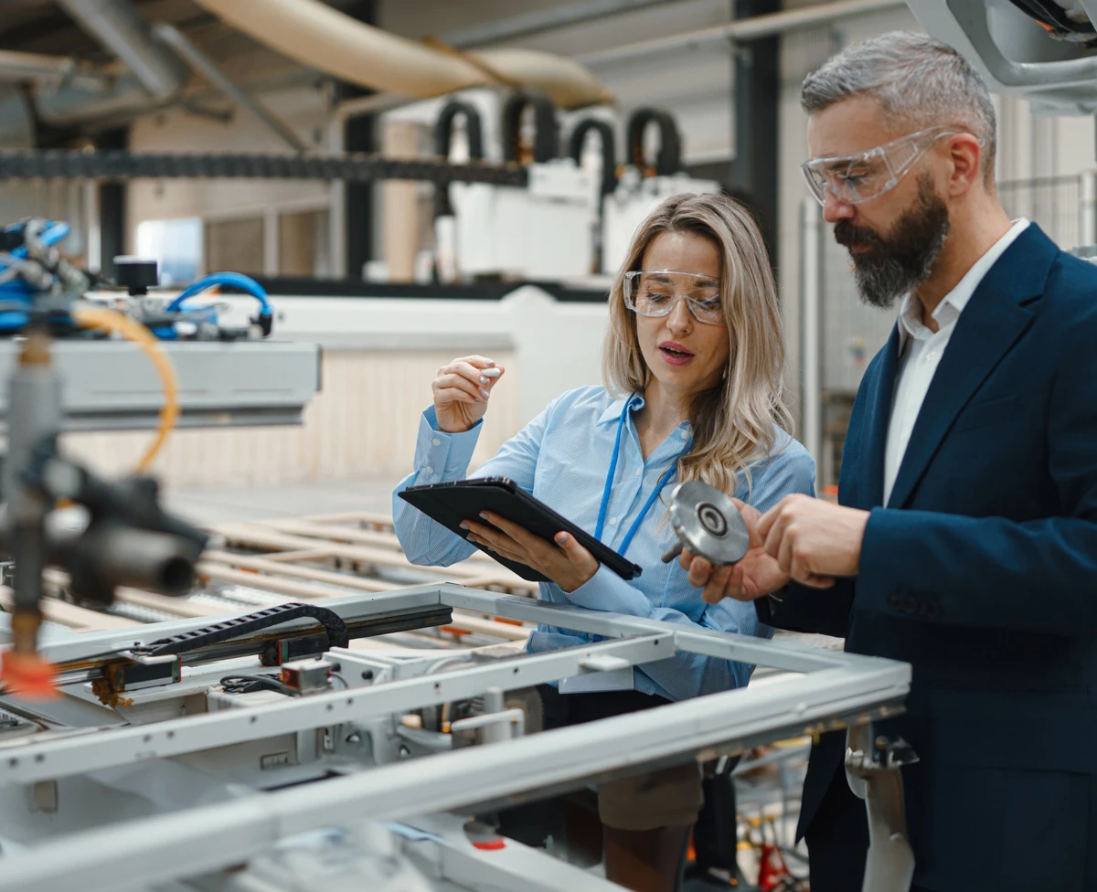 Two people optimizing operational performance