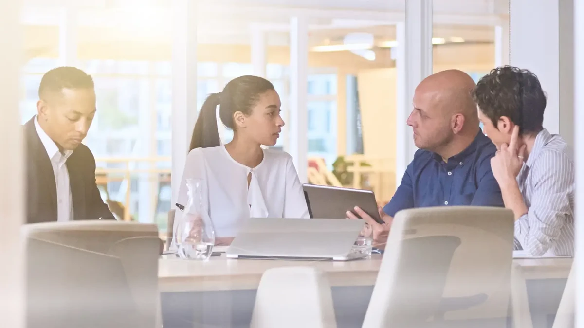 group of professionals in the office working together at the office