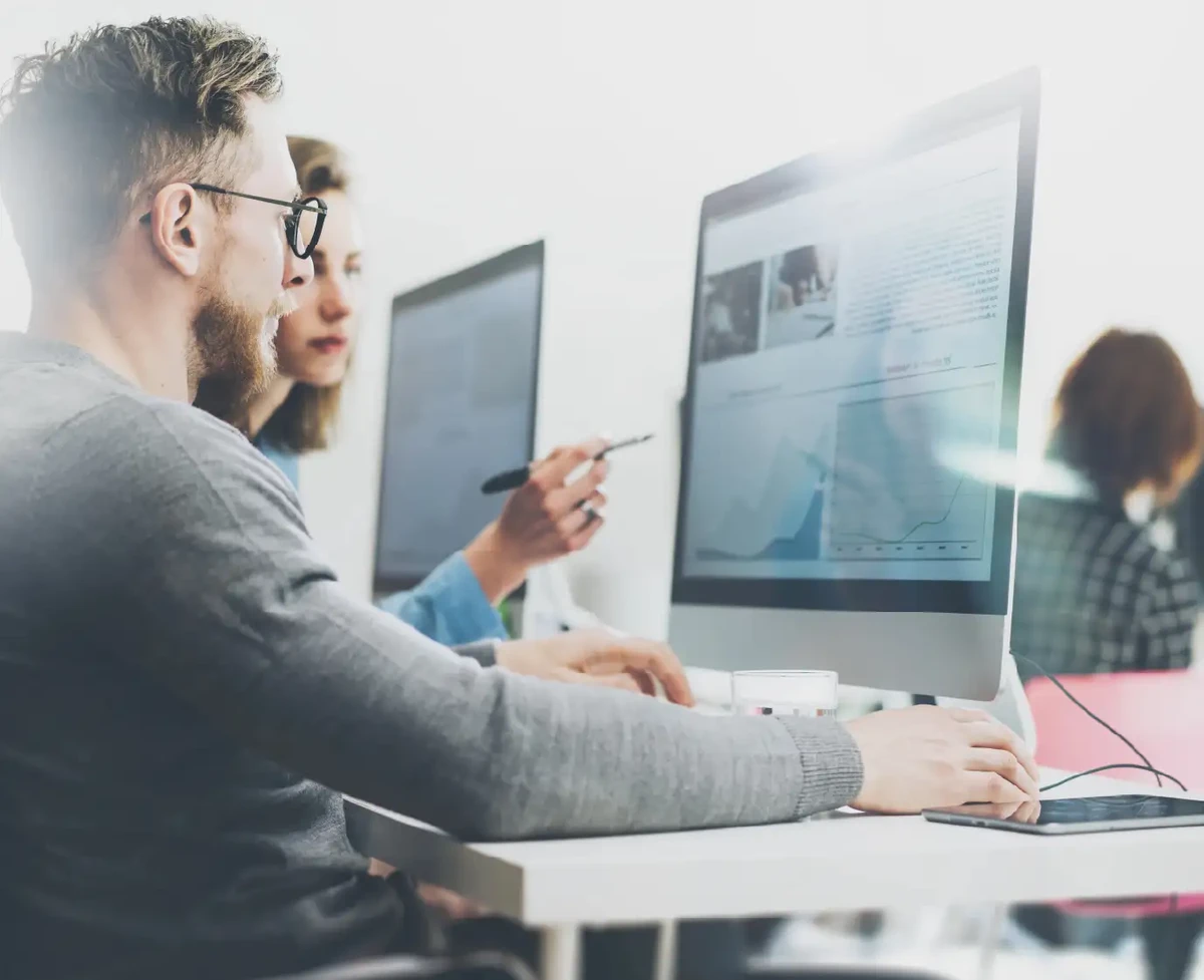 A man at a computer working on business innovation with SAP