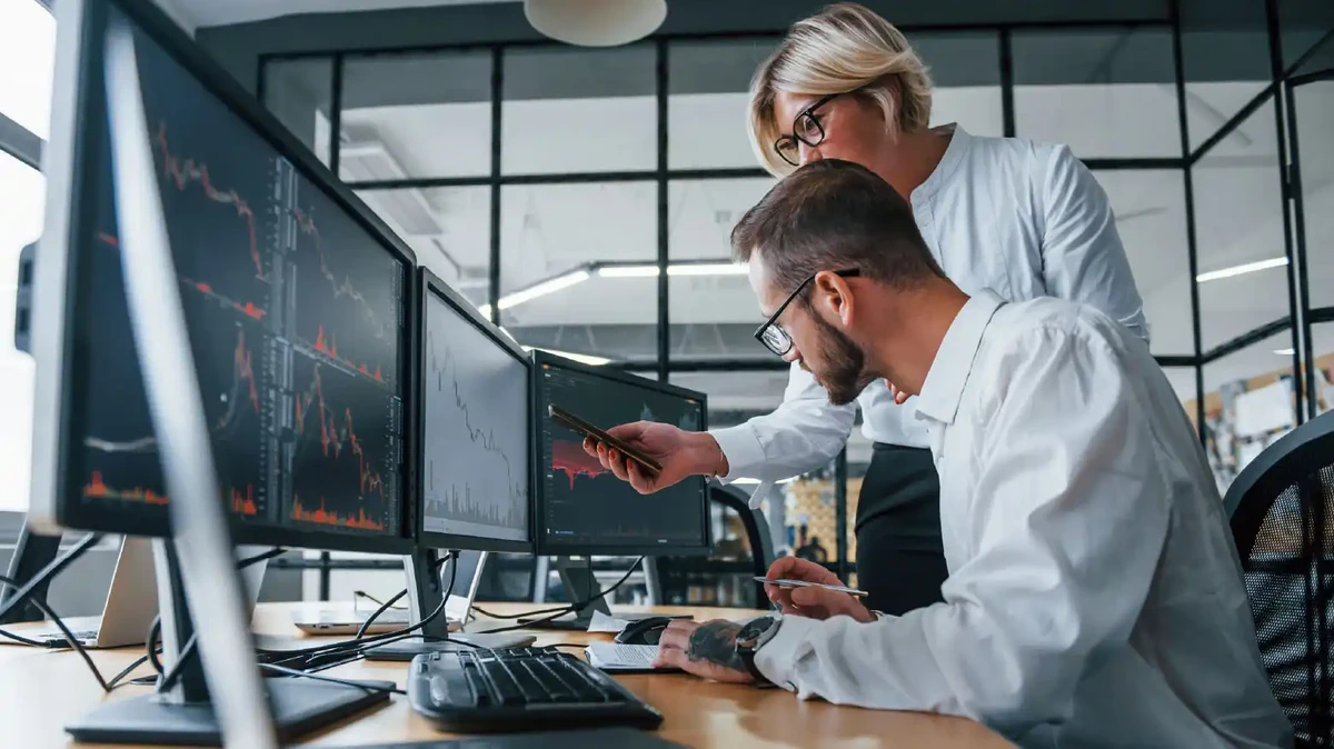 Two persons analyzing data