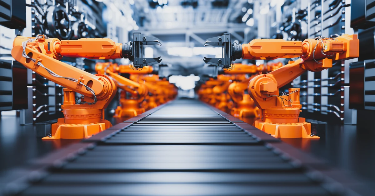Machine Learning - robotic arms along assembly line in modern factory.