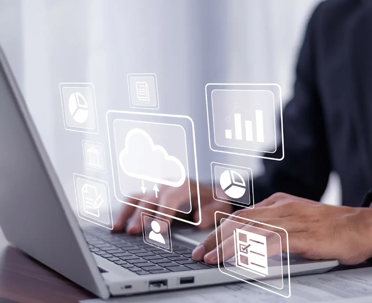 Computer displaying data icons and migration to the cloud