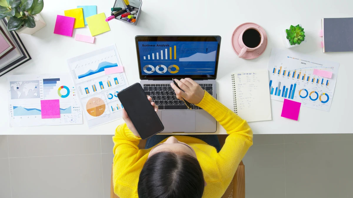 Woman reviewing data on a laptop