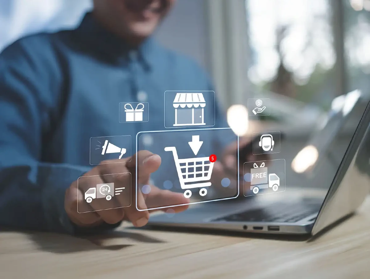 Concept shopping online. hand man shopper using a laptop computer touch add to cart icon. business, store,e-commerce technology.