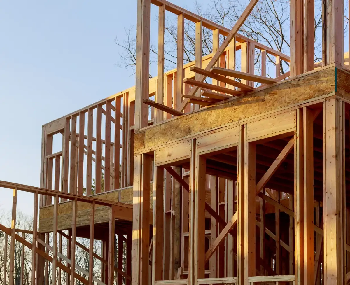 A house under construction with the beam frame in place.