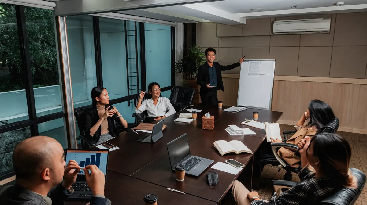 A business team in an office is reviewing strategic data insights