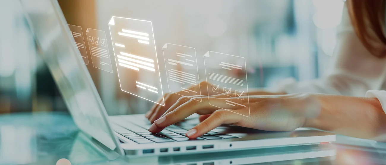 An employee is migrating digital forms on a laptop