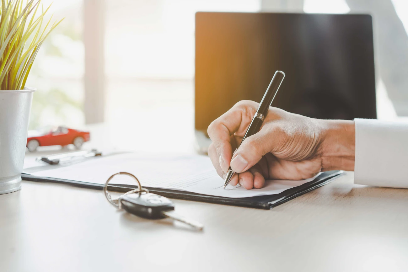 Hand Signing Car Lease Form