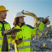 Co-workers on a mining territory with tablet