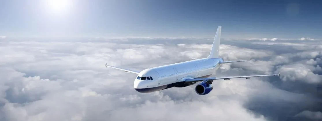 A plane flying above the clouds