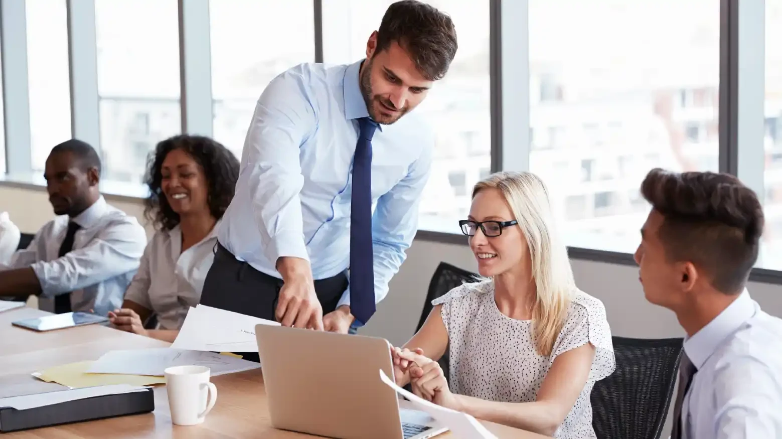 Team of women and men working on the functionalities based on the company's requirements.
