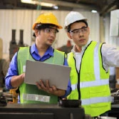 Two men managers, working on ERP migration with SAP