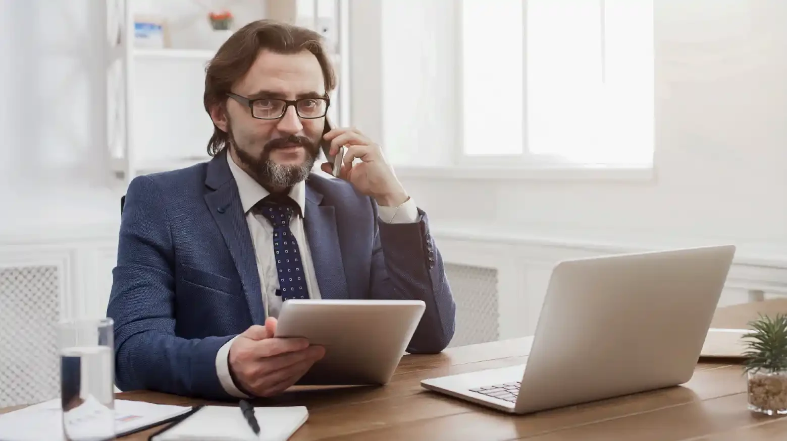 Male operations manager planning demand