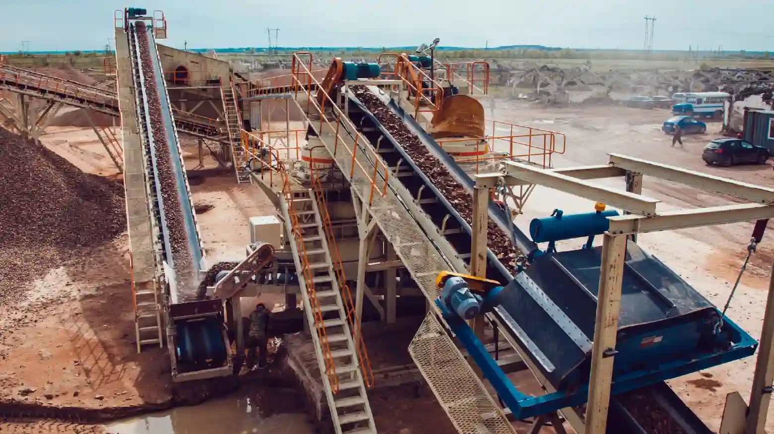Mining plant with large machines and workers