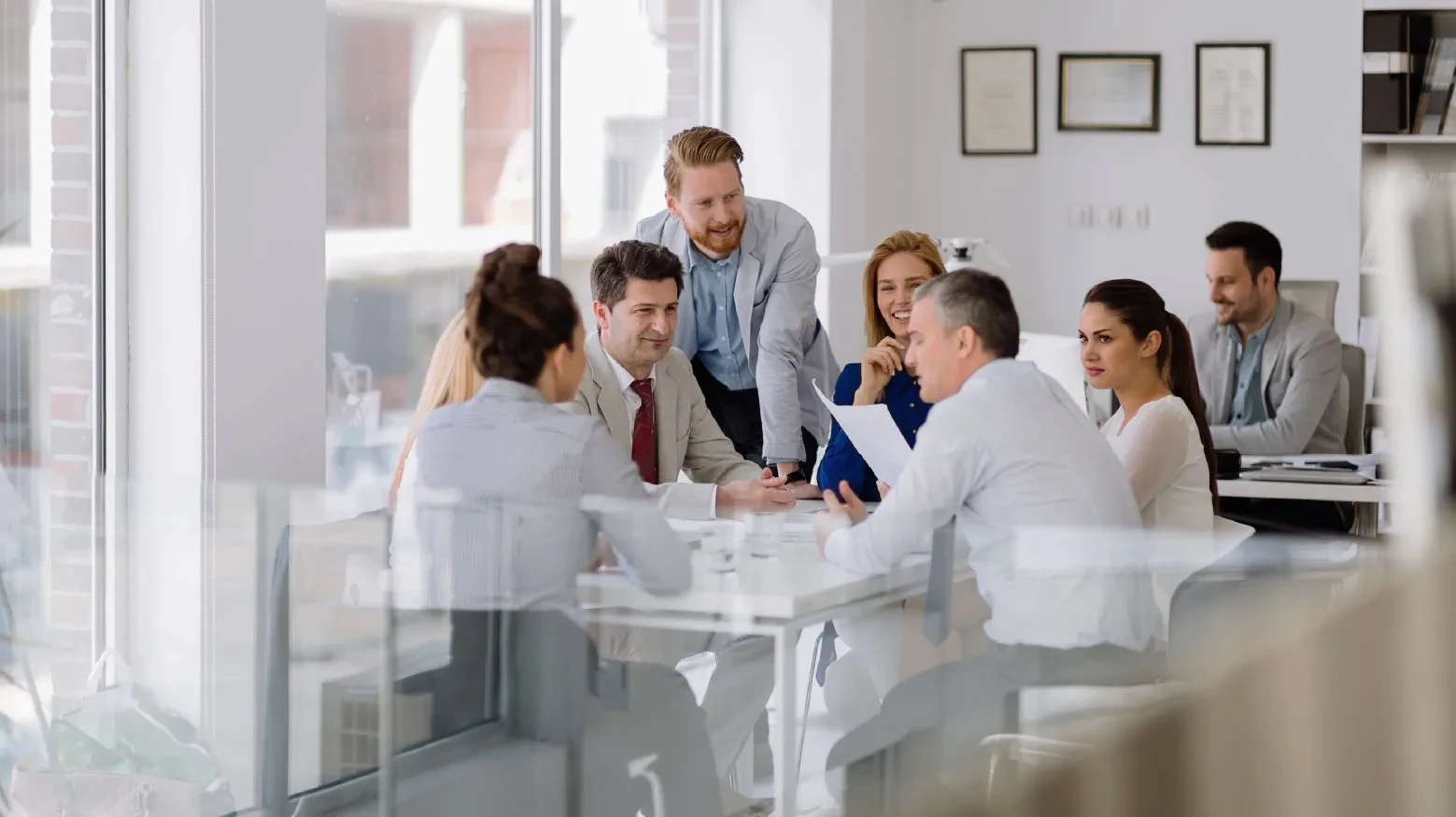 Talan team working as a team with potential customers in the office