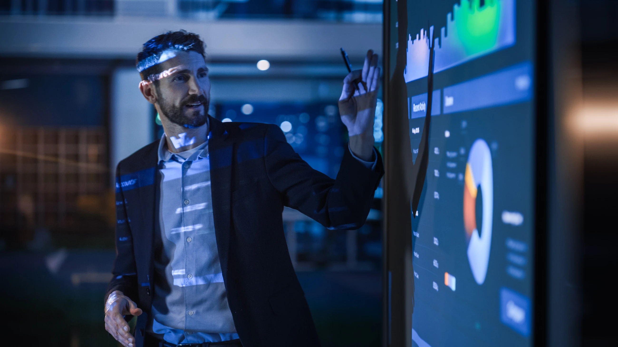 Businessman showing data to a group of investors and businesspeople