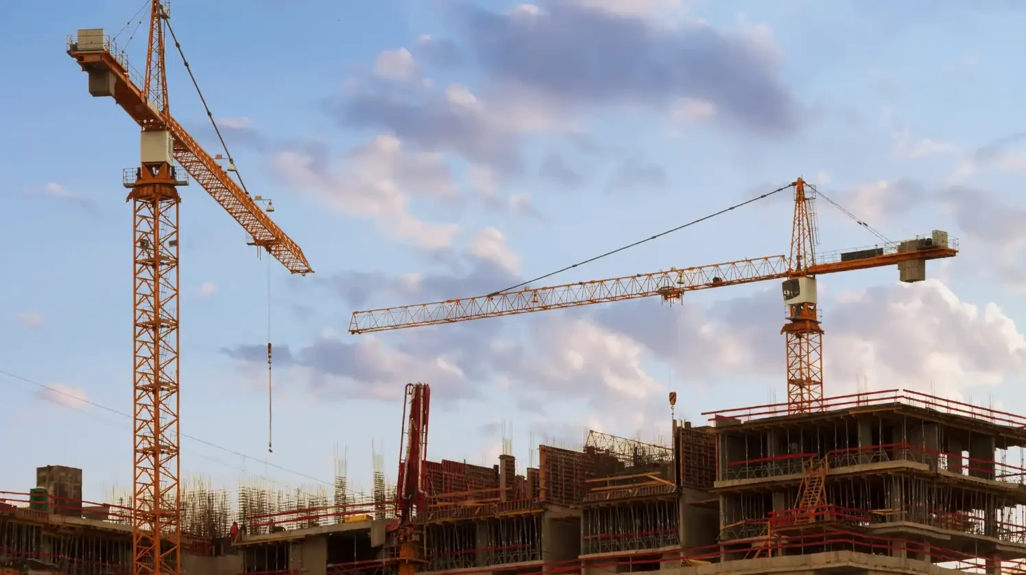 A construction site with high-rise buildings and cranes operating