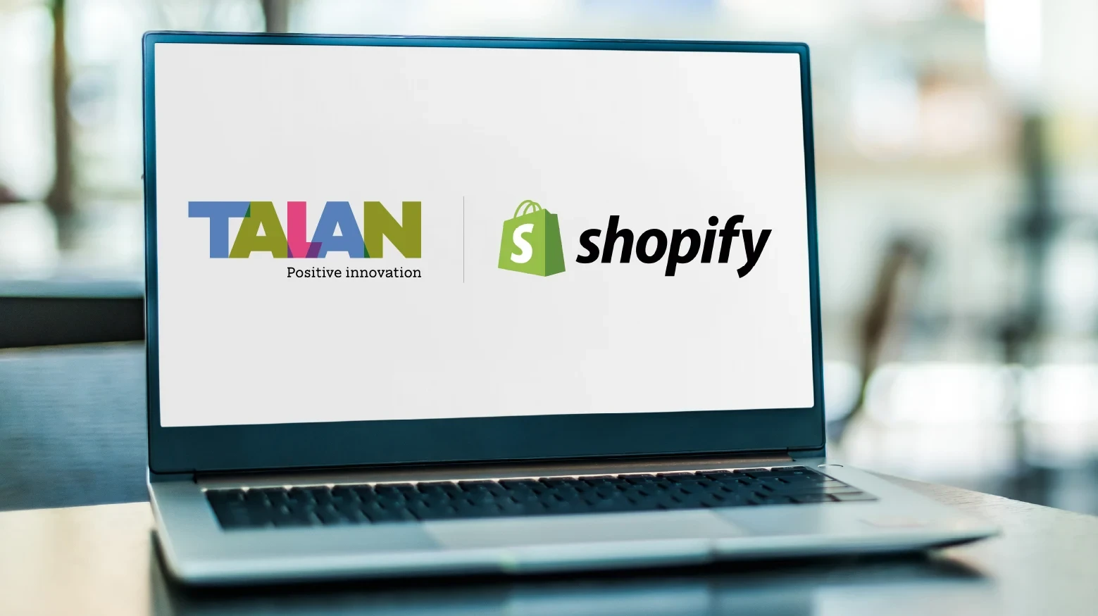 Shopify and Talan logo on a pc