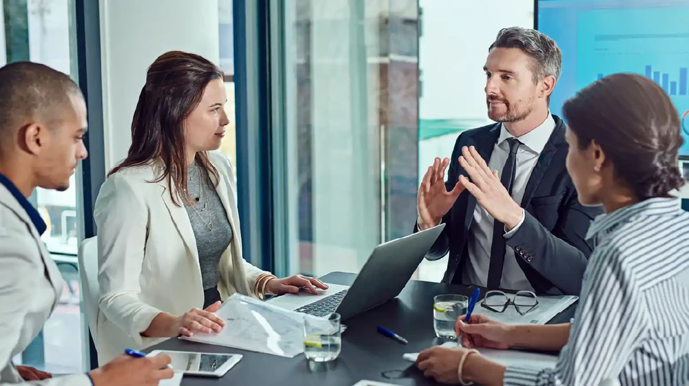 In-office team working with their clients high expectations in accurate reporting and cost forecasting.