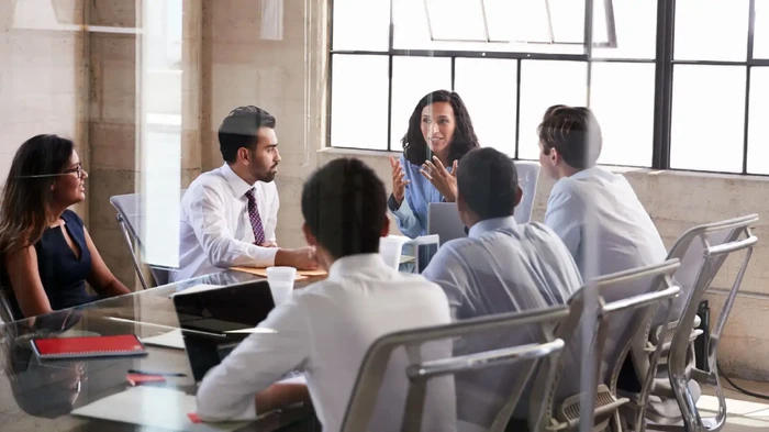 Consultant team with client in office