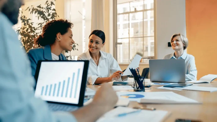Group of professional business managers working with documents in office and use laptop