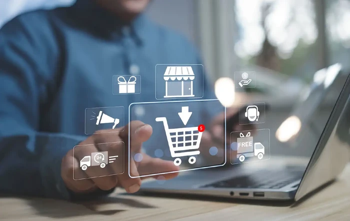 Concept shopping online. hand man shopper using a laptop computer touch add to cart icon. business, store,e-commerce technology.
