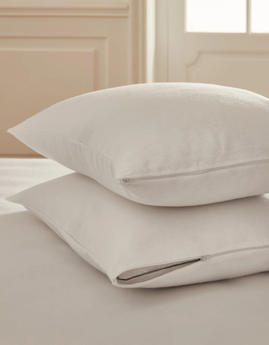 La paire de protège oreillers 100% coton